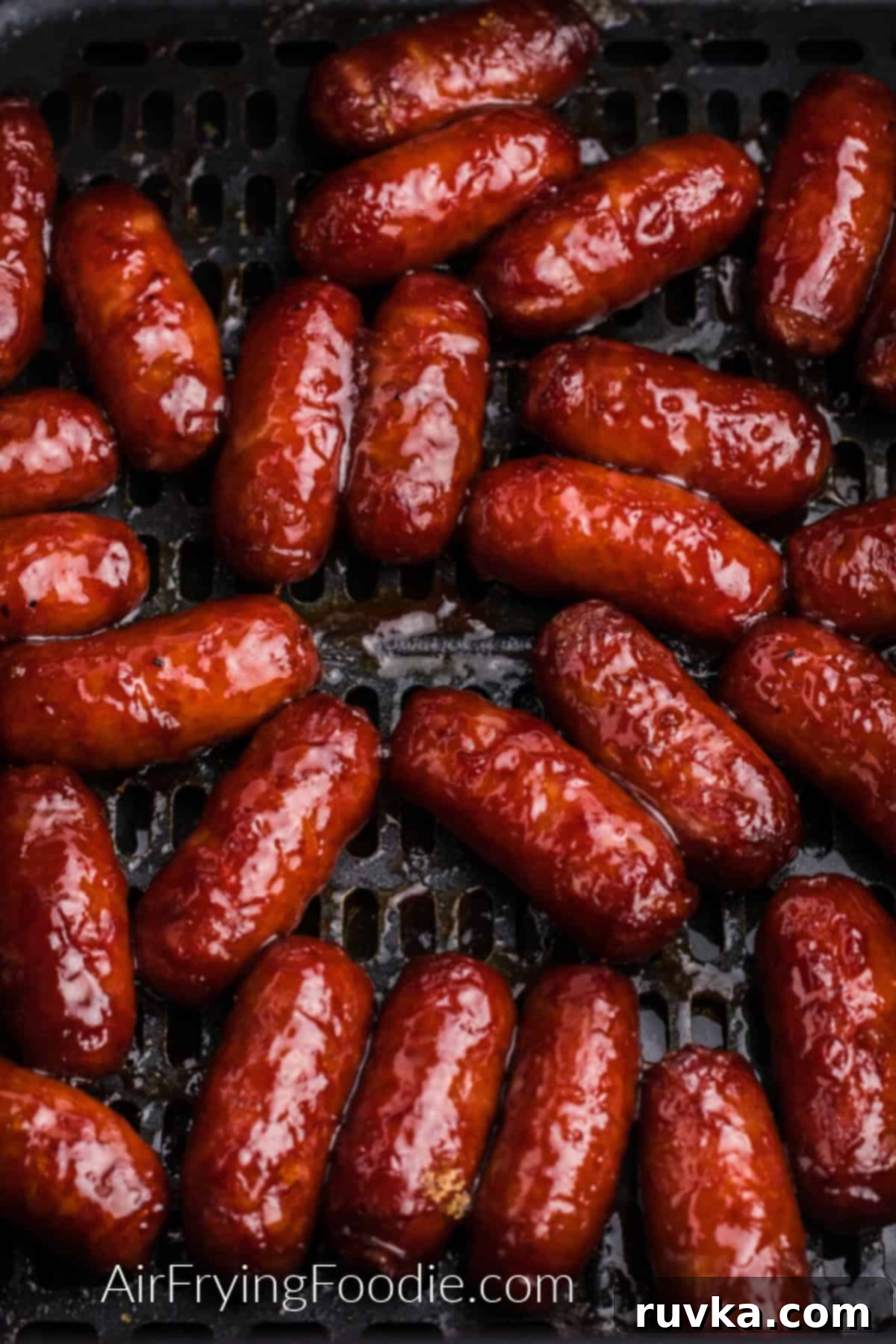 Easy Air Fryer BBQ Little Smokies 3 Cooked BBQ Litle Smokies in the basket of the air fryer.