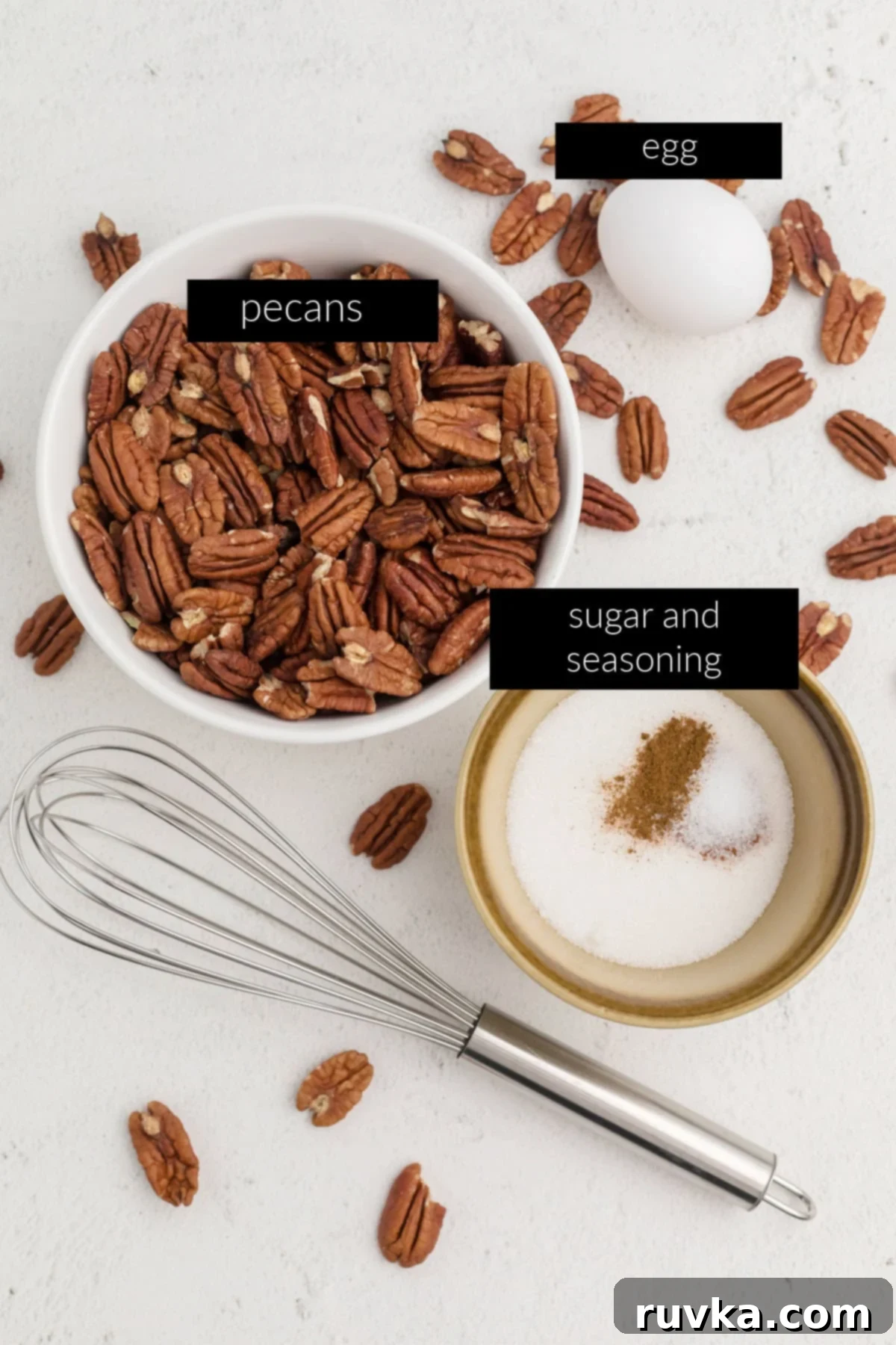 Golden Air Fryer Candied Pecans 3 Ingredients laid out: pecan halves, egg white, water, sugar, cinnamon, and salt, ready to make candied pecans in the air fryer.