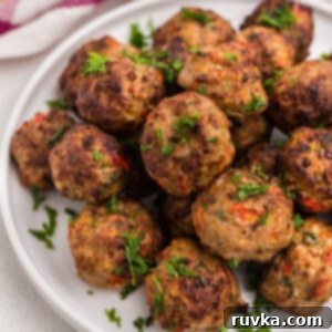 Crispy Air-Fried Turkey Meatballs 10 Air Fried Turkey meatballs garnished with fresh parsley.