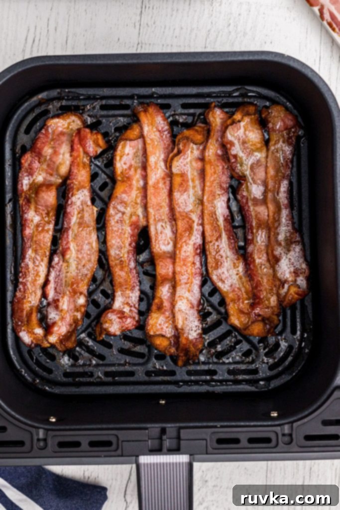 Crispy Air Fryer Bacon 4 Juicy crispy bacon in the air fryer basket.