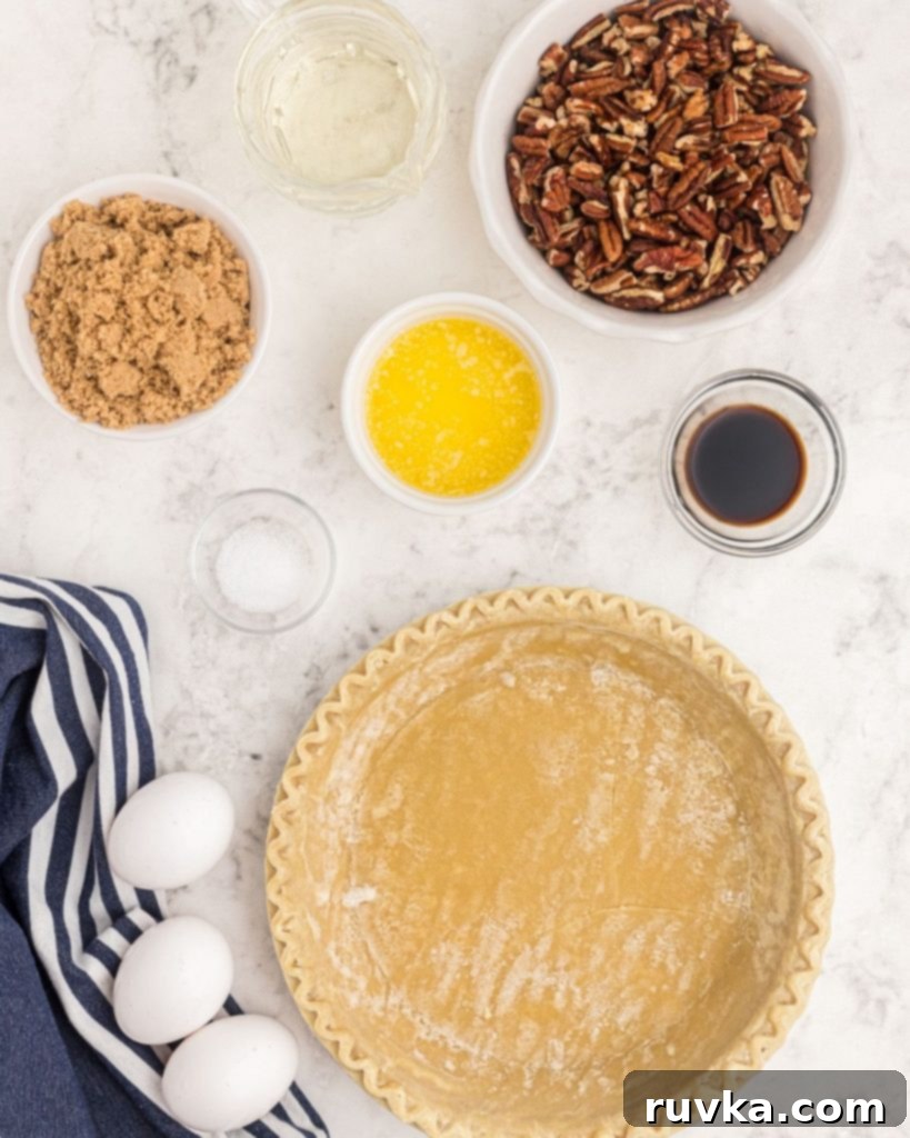 Perfect Air Fryer Pecan Pie 3 All the necessary ingredients laid out to make a delicious pecan pie from scratch, showcasing fresh nuts and baking staples.
