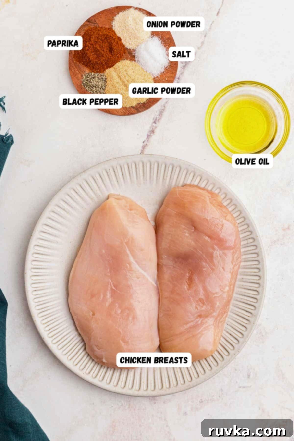 Perfect Air Fryer Chicken Breast 3 Ingredients needed to make chicken breast measured onto marble table.