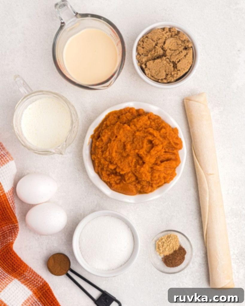 Air Fryer Pumpkin Pie 3 Ingredients needed to make pumpkin pie laying on a white marble table.