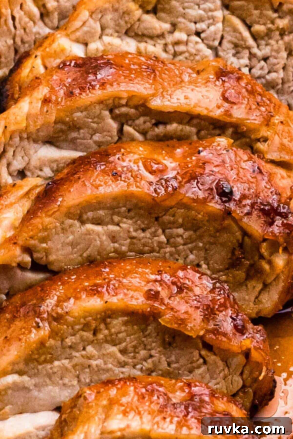 Tender Air Fryer Pork Tenderloin in a Flash 9 Juicy sliced tenderloin with a caramel glaze on the outside.