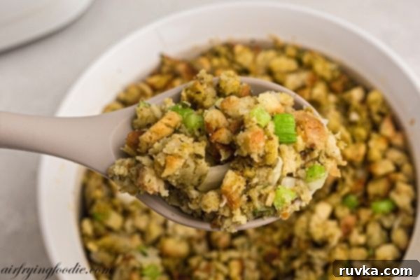 Perfectly Crispy Air Fryer Stuffing 2 Golden stuffing in a spoon with celery and onion.