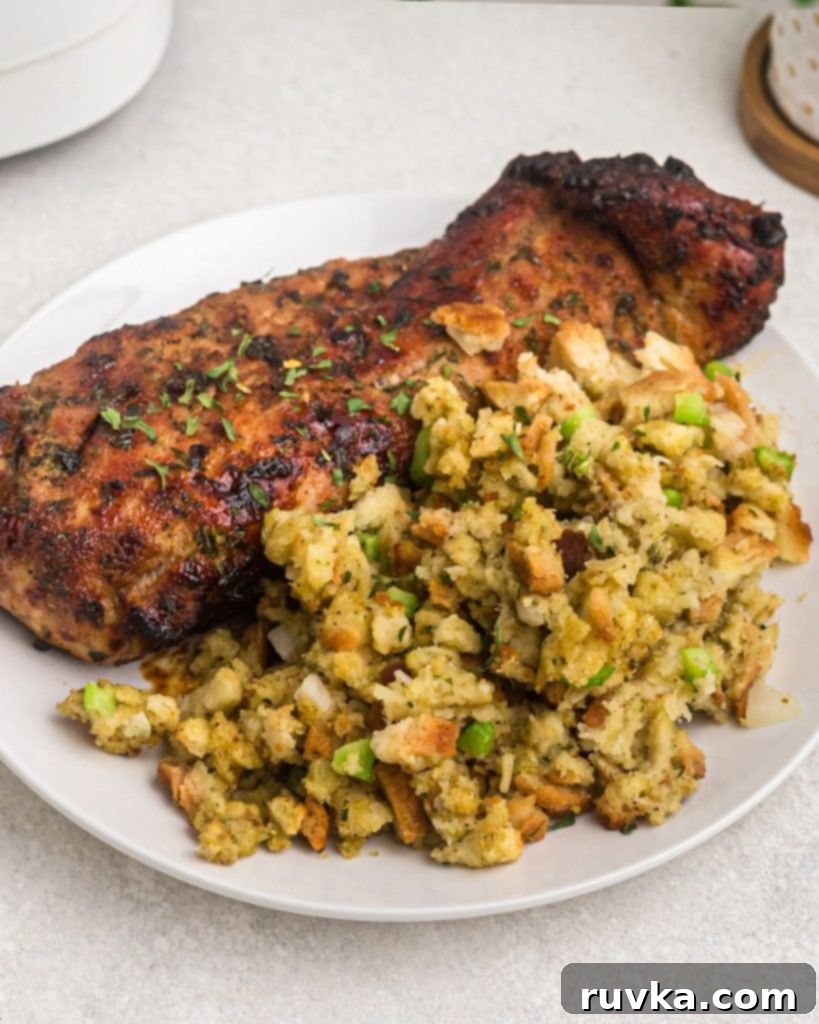 Perfectly Crispy Air Fryer Stuffing 3 Yellow stuffing cooked until golden, served on a white plate with a tenderloin.
