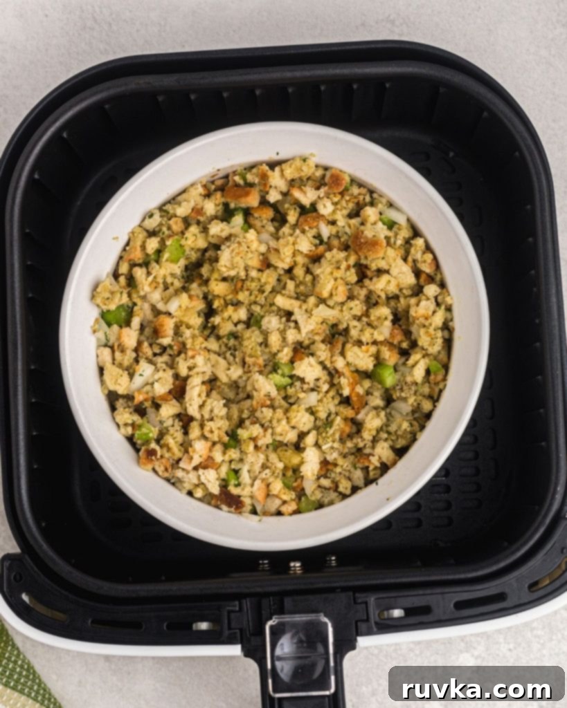 Perfectly Crispy Air Fryer Stuffing 6 Stuffing mixture combined in a white bowl before cooking in an air fryer basket.