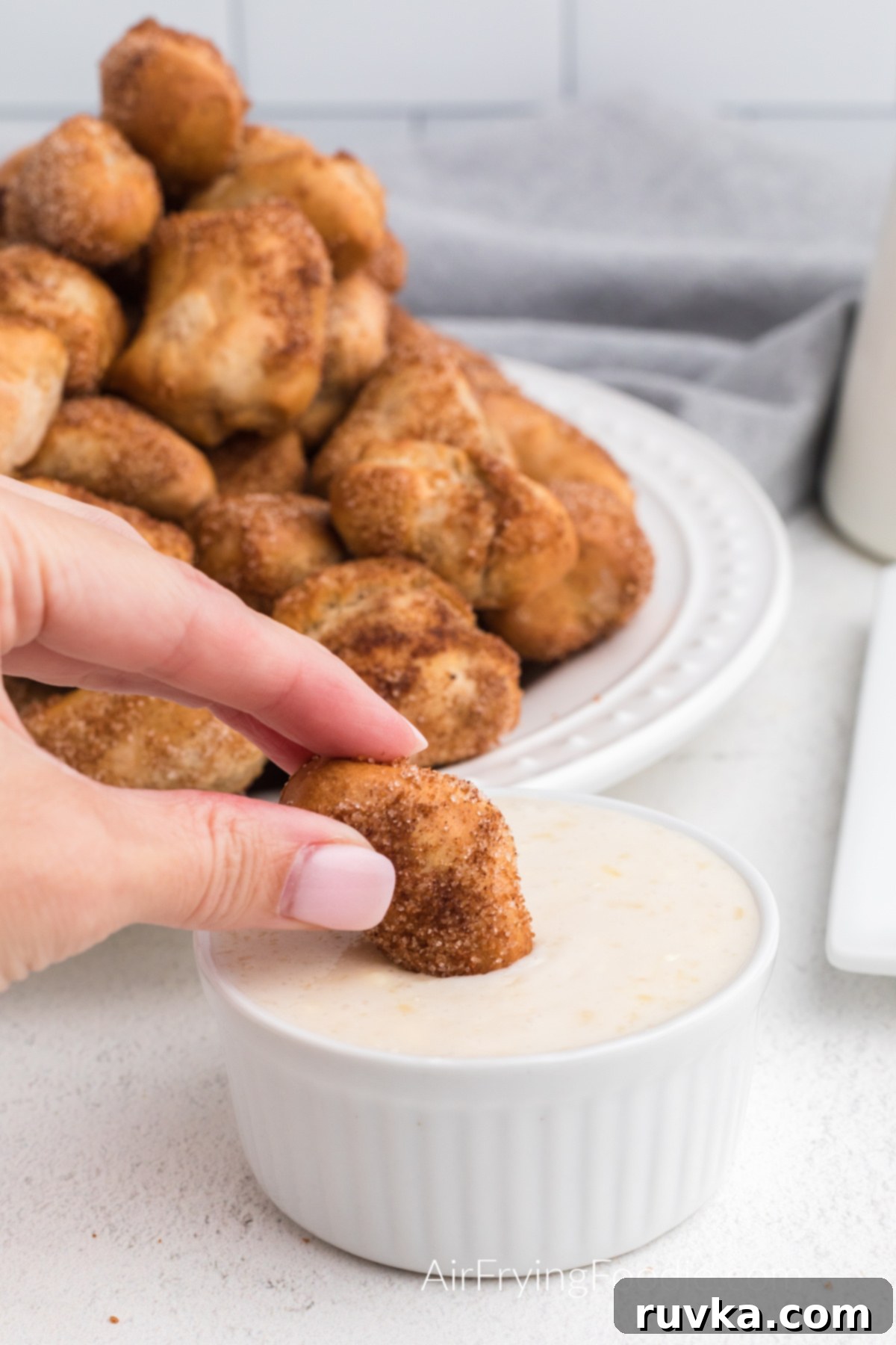 Air Fried Pretzel Perfection 12 Cinnamon Sugar Air Fryer Pretzel Bites dipped in sugary glaze dipping sauce.