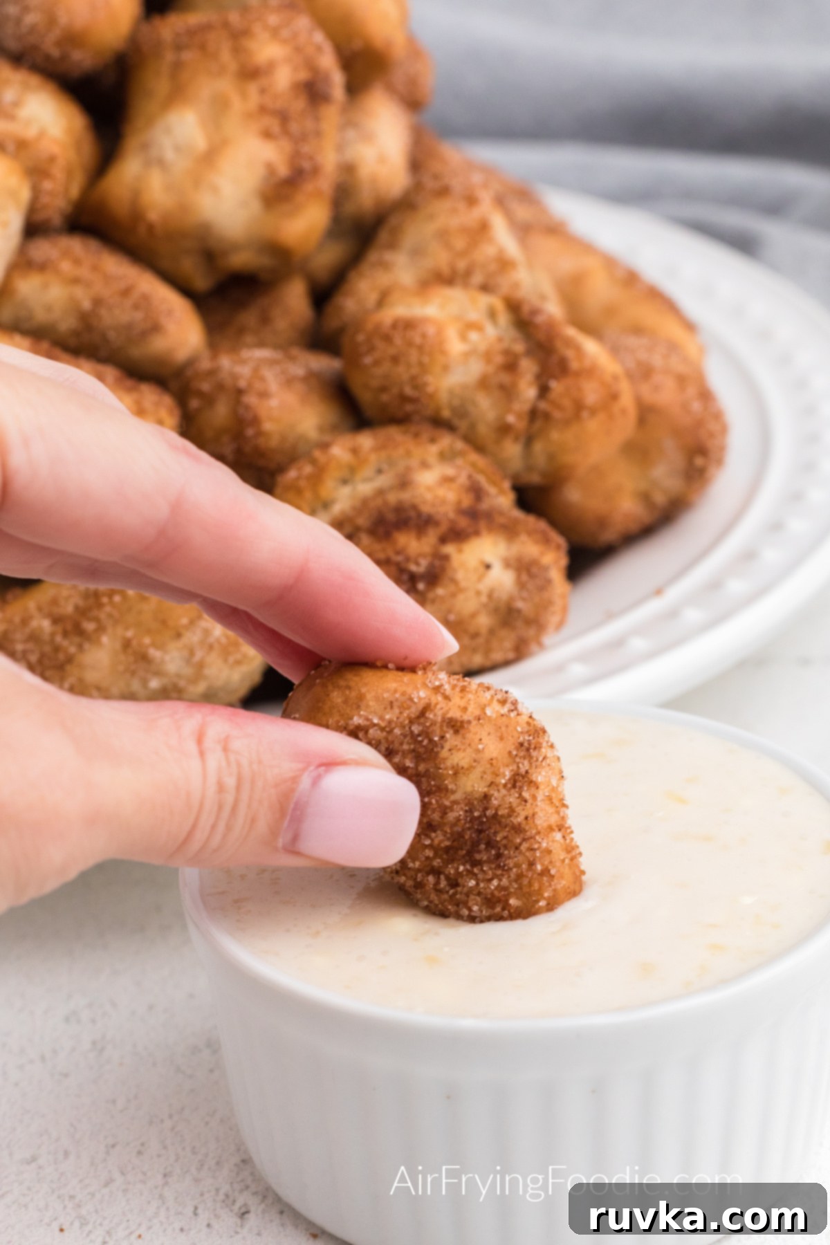 Air Fried Pretzel Perfection 13 Cinnamon Sugar Pretzel Bites made in the air fryer dipped in the sugar glaze dipping sauce.