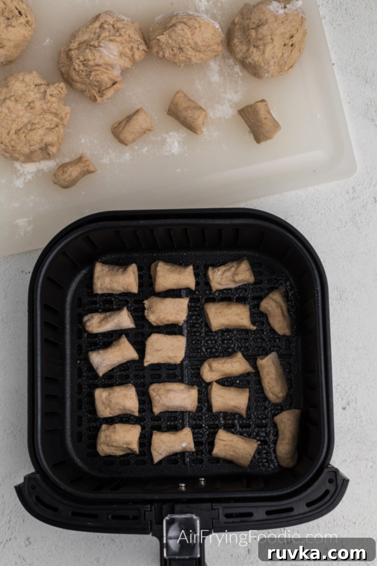 Air Fried Pretzel Perfection 8 pretzel bites in a single layer ready to be cooked in the air fryer basket.