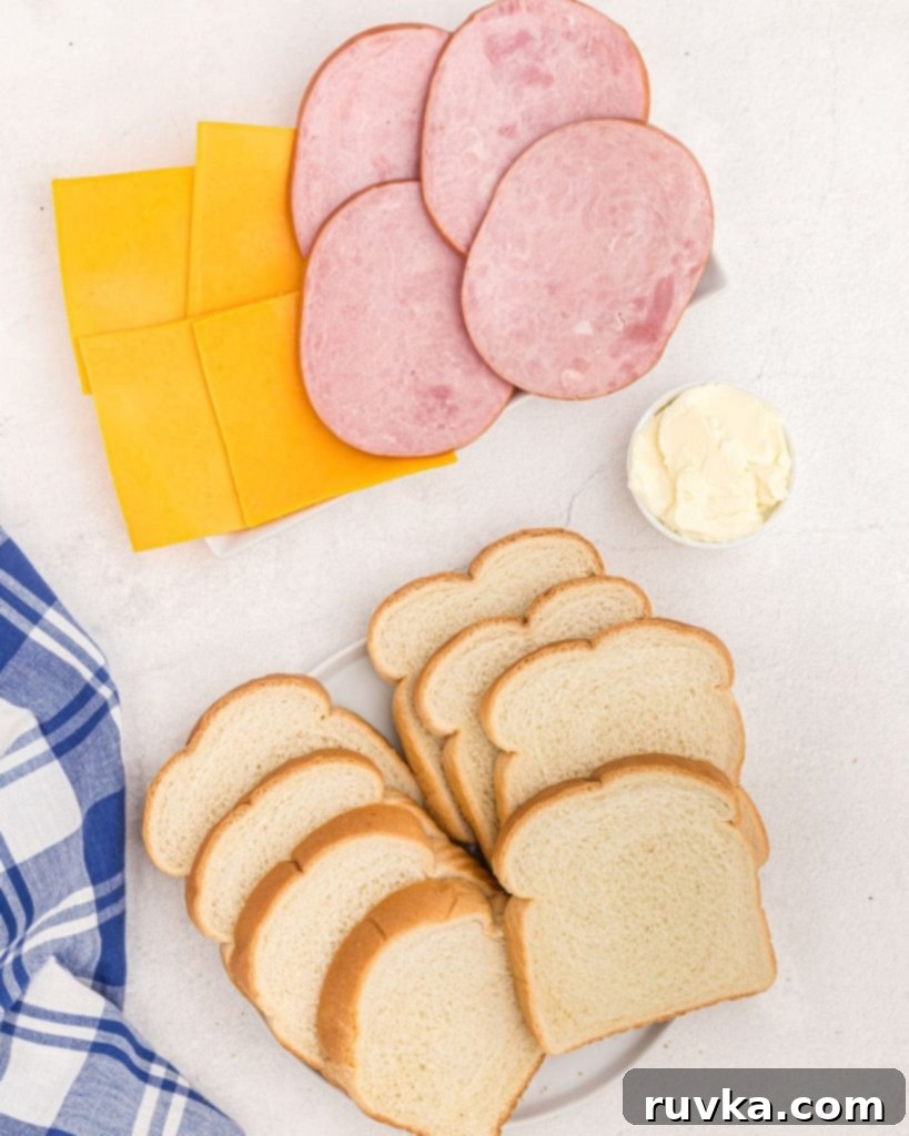 Air Fryer Golden Ham and Cheese Melt 3 Ingredients needed to make ham and cheese sandwiches in the air fryer, bread, ham, cheese, butter.