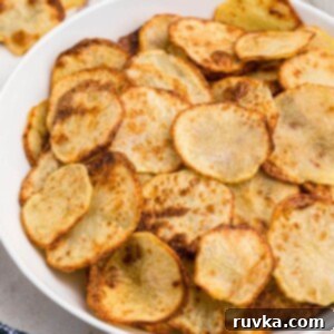 Crispy Air Fryer Sides 13 Golden crispy potato chips in a white bowl