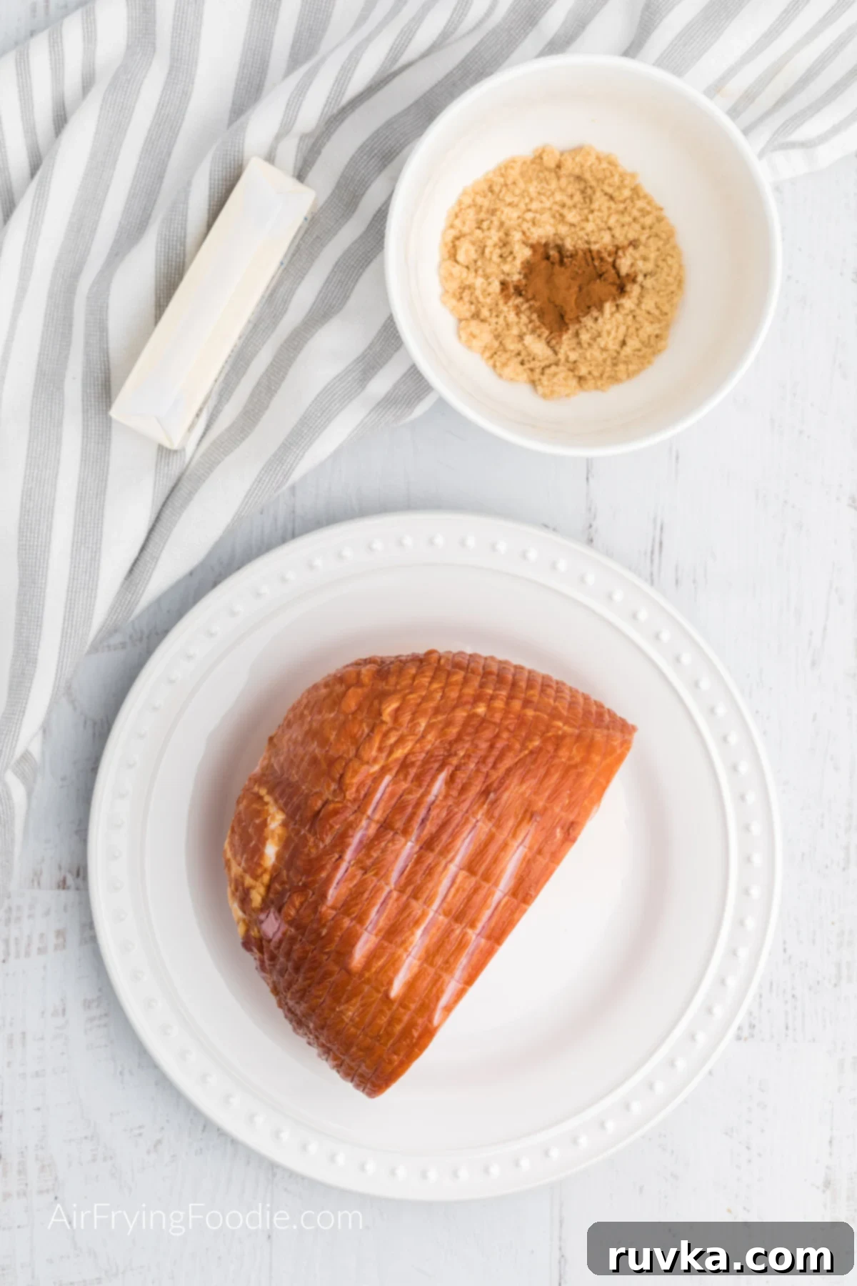 Crispy Air Fryer Ham 3 Ingredients needed to make an air fried ham with butter and brown sugar glaze, neatly arranged.