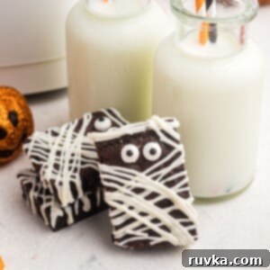 Halloween Air Fryer Mummy Brownies 10 Brownies frosted to look like mummies with candy eyes, leaning up against little bottles of milk