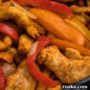 Crispy Air Fryer Chicken Bites 6 Air Fryer Chicken Fajitas with bell peppers and onions.