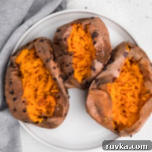 Air Fryer Thanksgiving Feast Made Easy 14 Overhead photo of sweet potatoes on a white plate that were made using an air fryer.