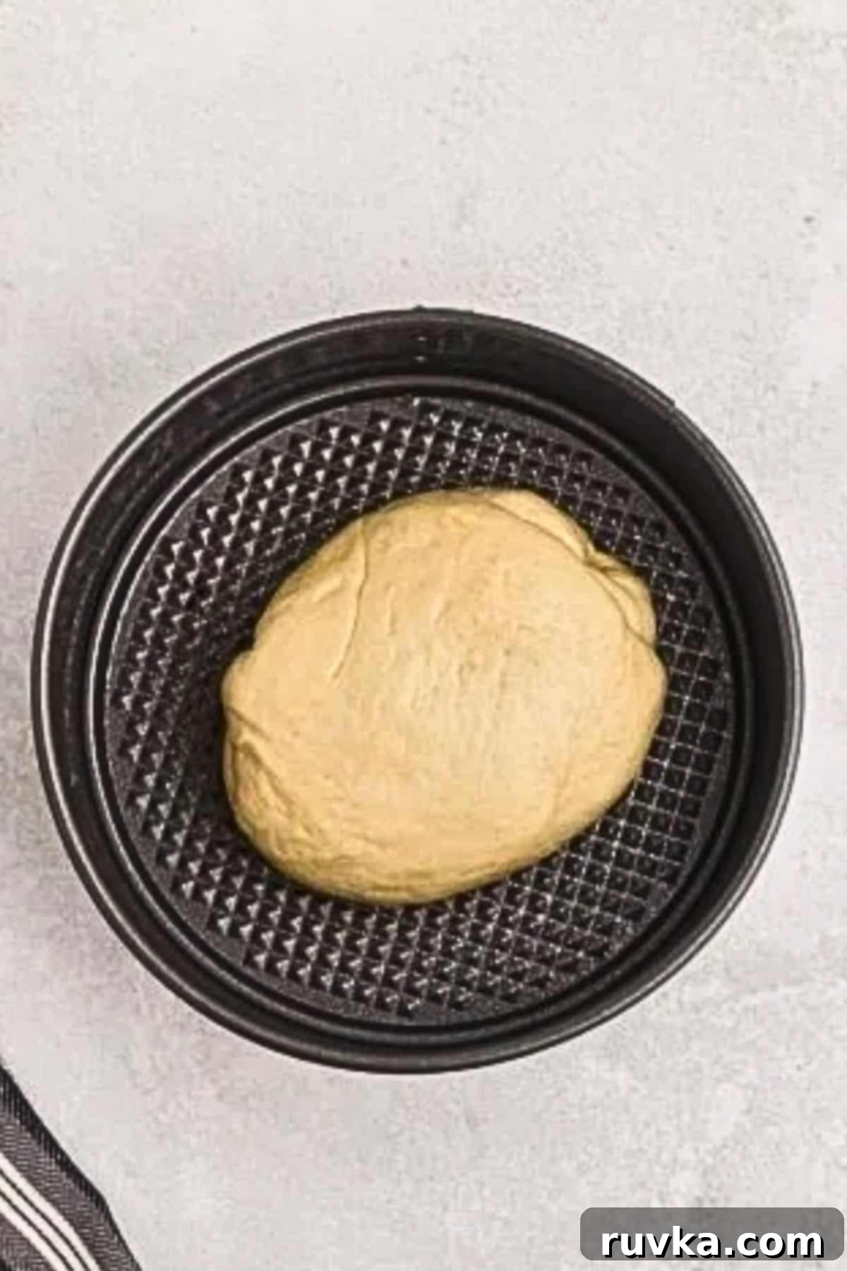 Bake Bread in Your Air Fryer 6 Bread dough in a springform pan, before rising and baking.