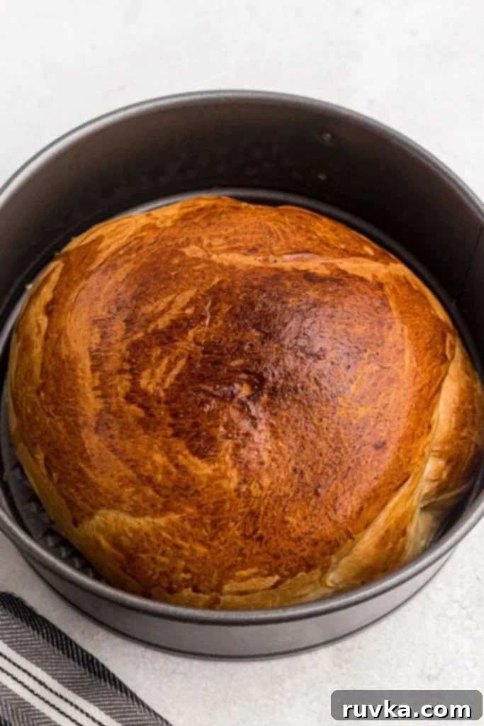 Bake Bread in Your Air Fryer 8 Golden loaf of bread after being cooked in the spring form pan