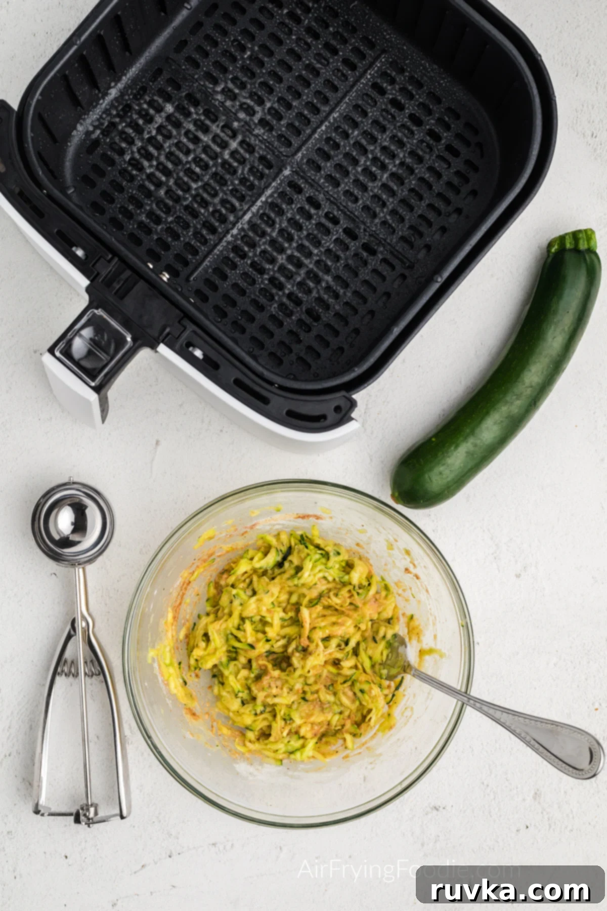 Crispy Air Fryer Zucchini Fritters 5 Zucchini fritter batter mixed and ready to be placed into the air fryer basket.