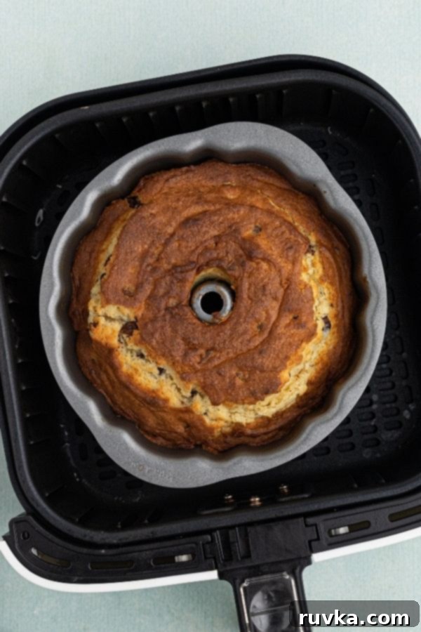 Air Fried Chocolate Chip Pound Cake 4 Cooked chocolate chip pound cake in a bundt cake pan, just removed from the air fryer basket.