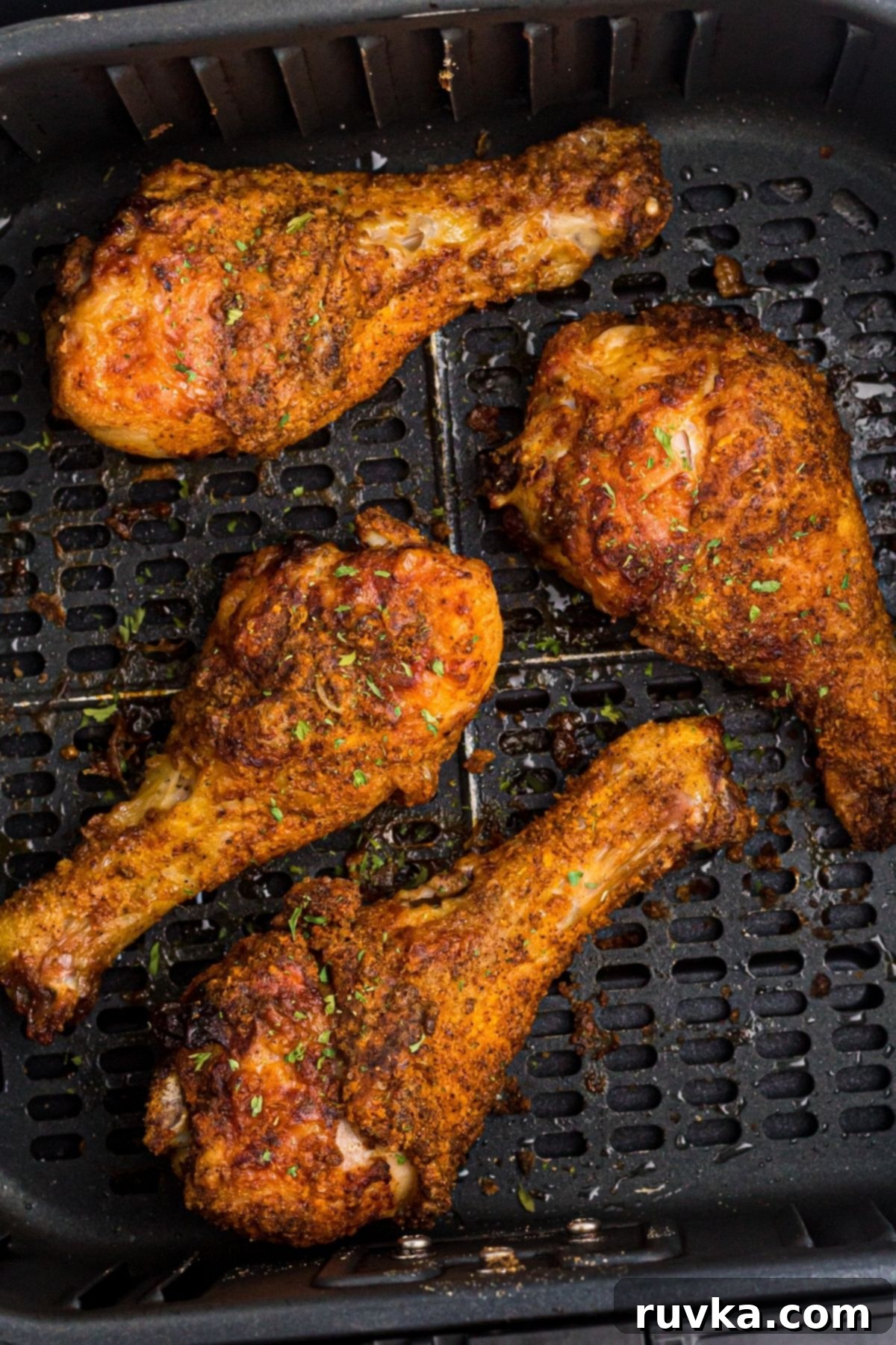 Crispy Air Fryer Drumsticks 7 Crispy chicken drumsticks in the air fryer basket.