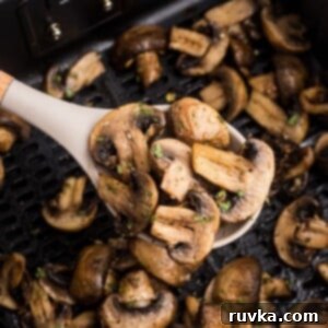 Perfectly Crispy Air Fryer Mushrooms 9 Juicy spoonful of mushrooms after being cooked in the air fryer
