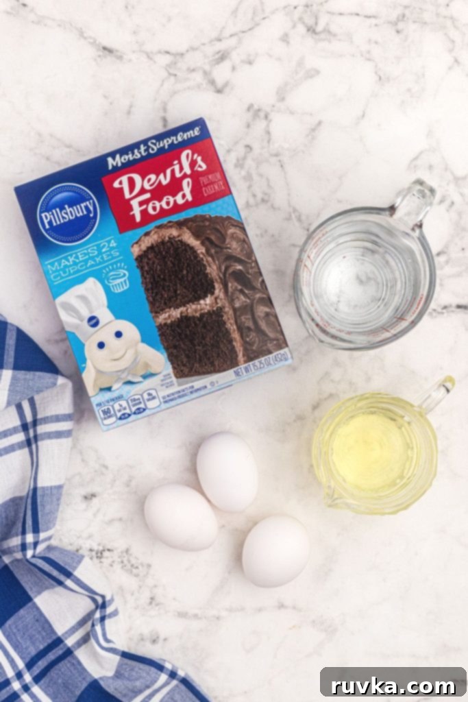 Quick and Delicious Air Fryer Cake 3 Box cake mix with oil, eggs, and water needed to make cake in air fryer on a white marble board