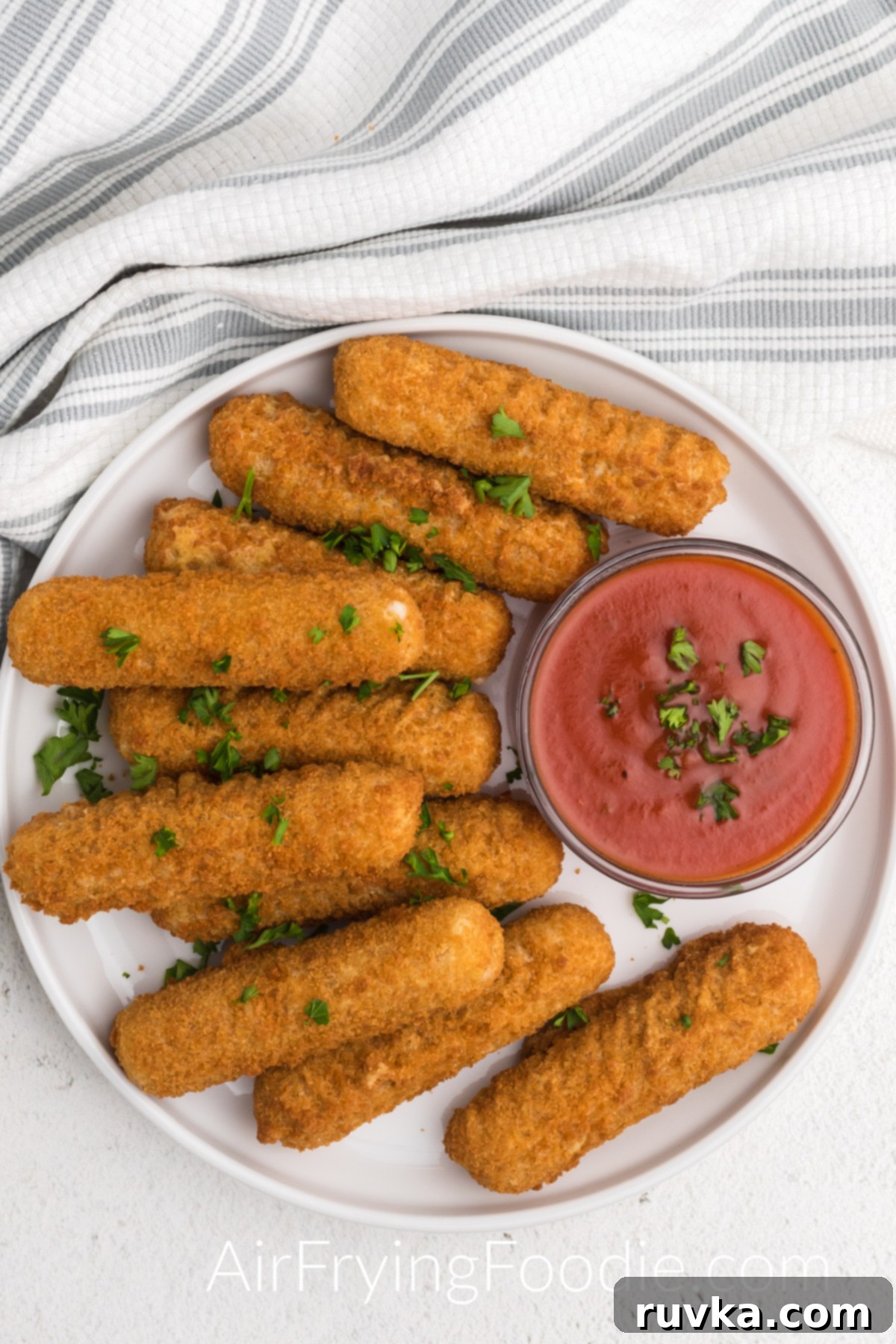 Crispy Air Fryer Mozzarella Sticks 3 plate full of mozzarella sticks made from frozen in the air fryer