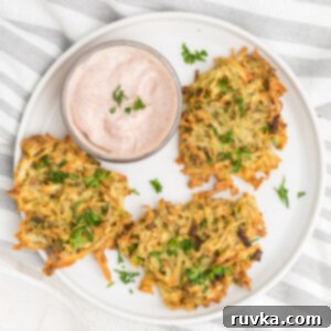 Crispy Air Fryer Latkes 10 Latkes made in the air fryer on a serving plate.