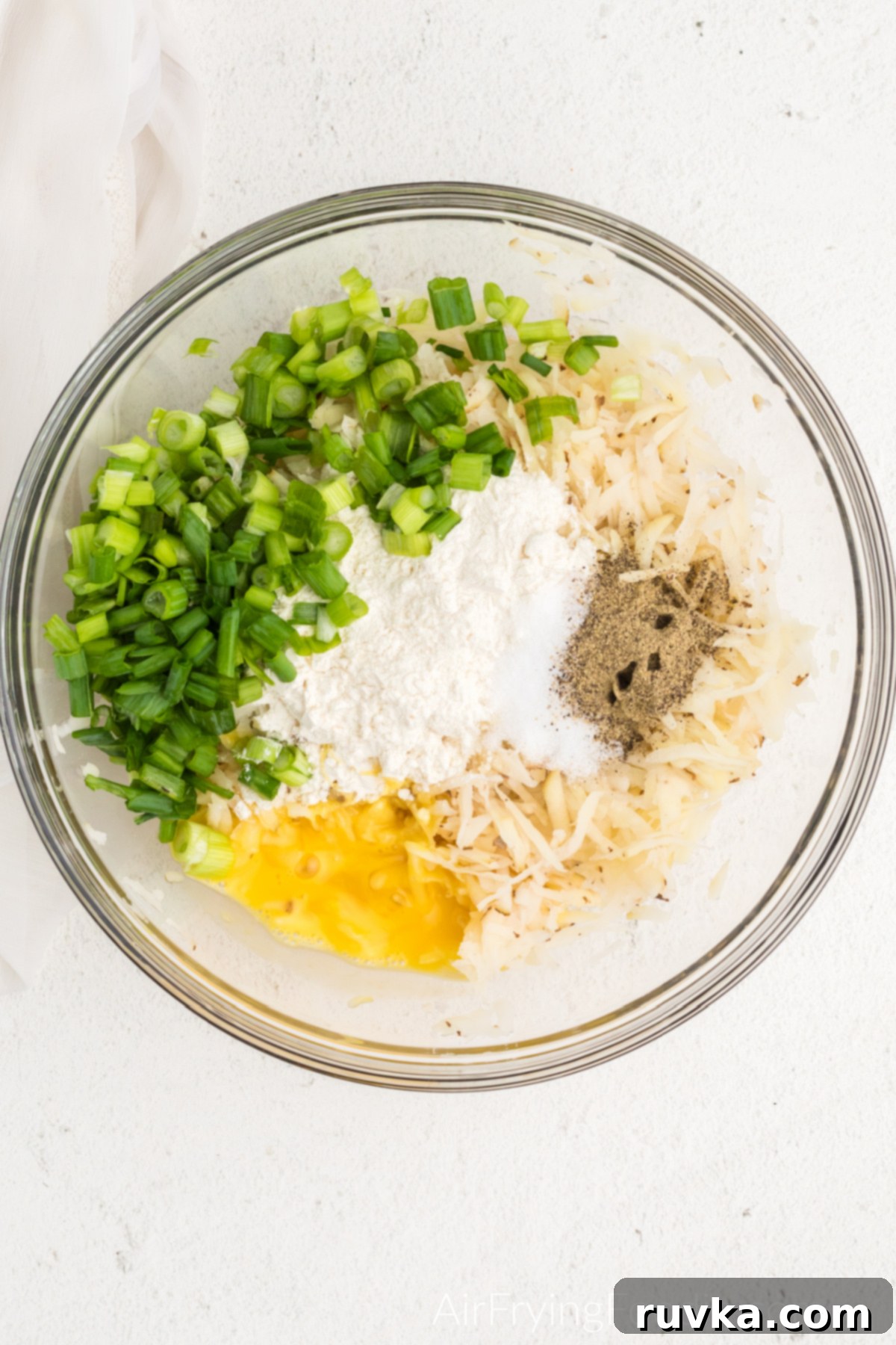 Crispy Air Fryer Latkes 6 Ingredients in a bowl used to make latkes.