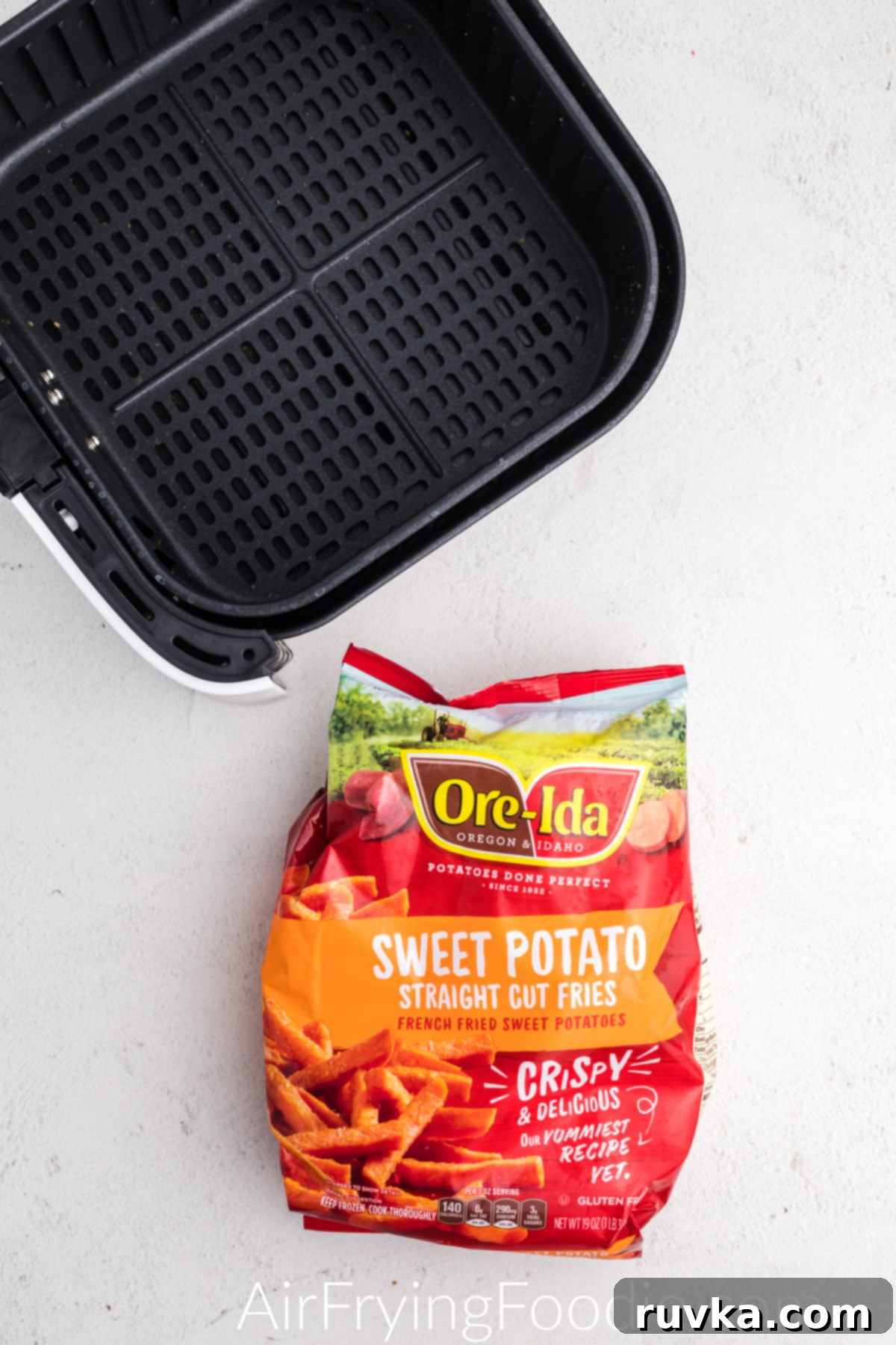 Ore Ida Frozen Sweet Potato Fries in a bag ready to be placed into the air fryer basket. 