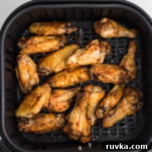 Frozen Food Favorites for the Air Fryer 15 Crispy chicken wings seasoned and perfectly cooked in the air fryer basket.