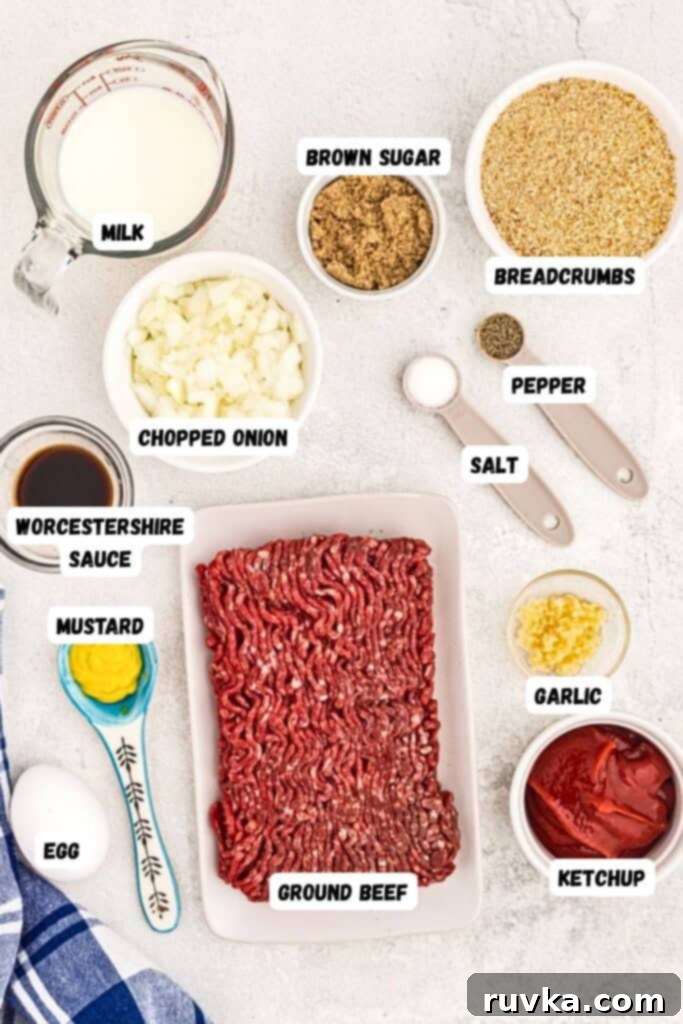 Easy Air Fryer Meatloaf 3 Ingredients measured into bowls and spoons on a white marble table