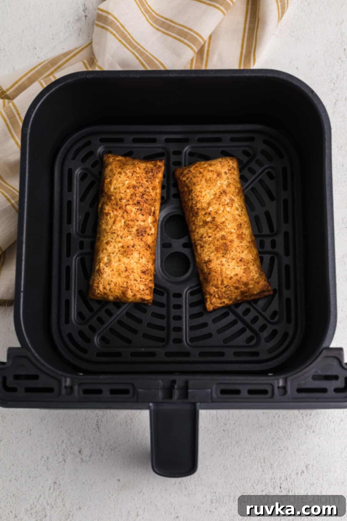 Crispy Air Fryer Hot Pockets 5 Golden brown hot pockets in air fryer basket, fully cooked and ready to serve.