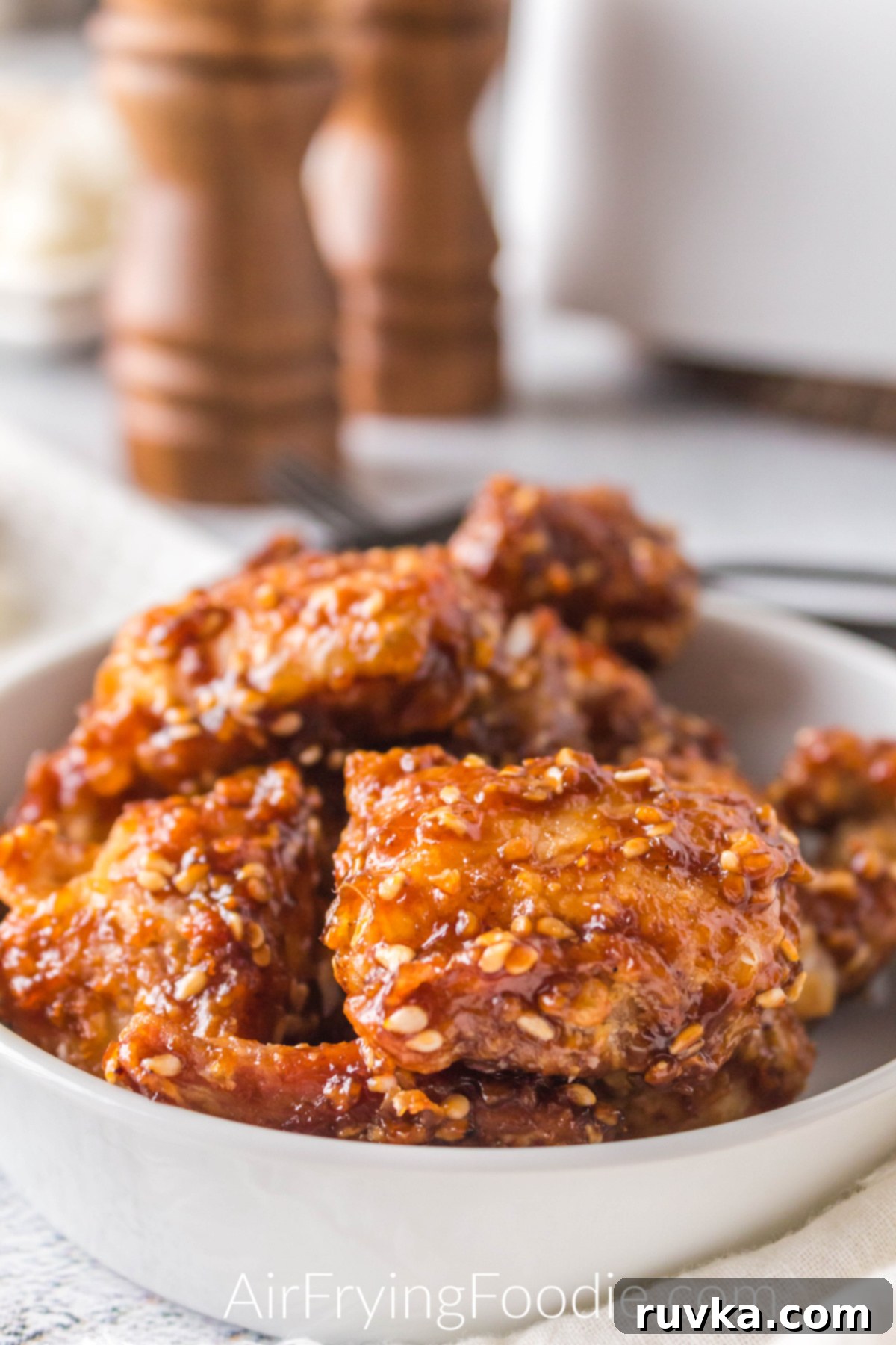 Crispy Golden Air Fryer Sesame Chicken 8 Air Fryer Sesame chicken in a bowl ready to serve.