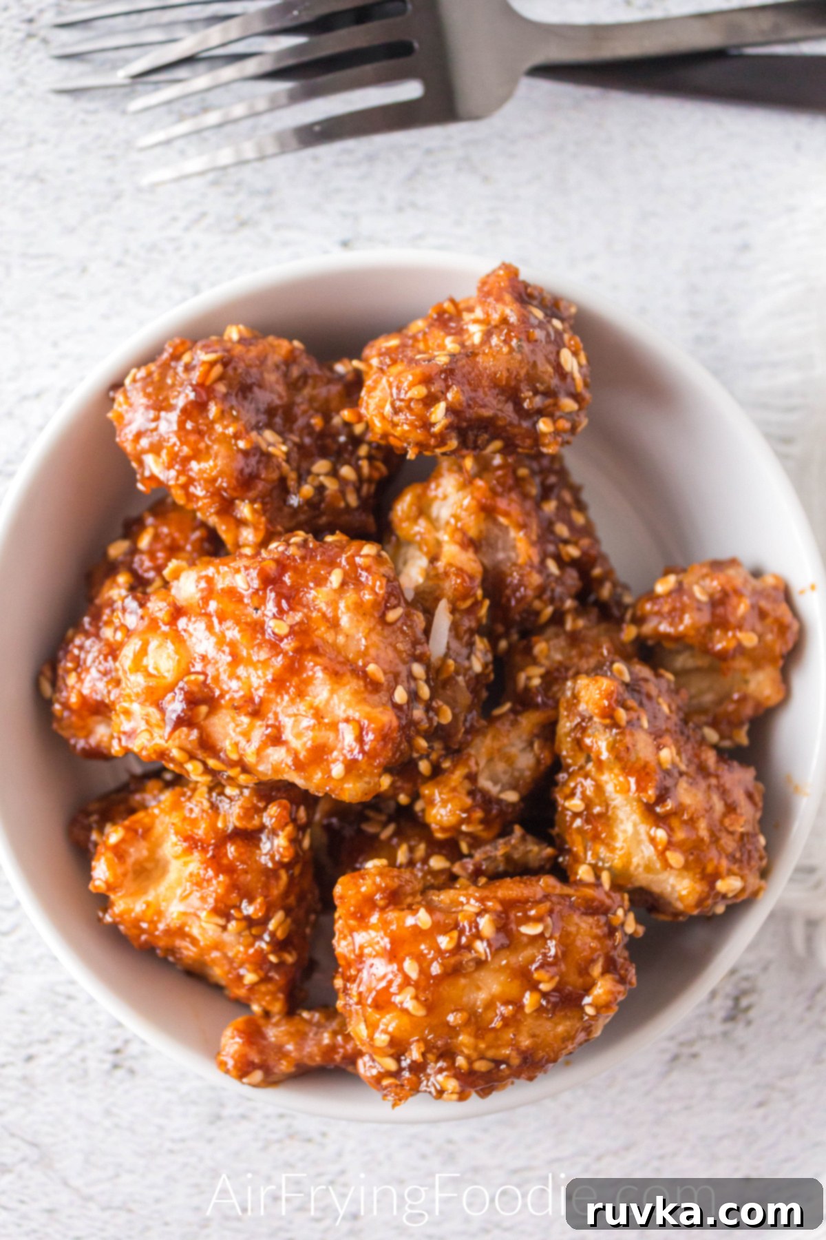 Crispy Golden Air Fryer Sesame Chicken 7 Air fryer sesame chicken in a bowl ready to serve.