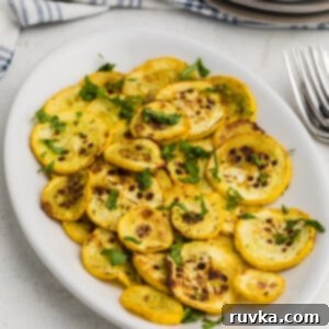 Crispy Air Fryer Veggies 6 Yellow squash cooked in the air fryer on a white plate and ready to serve.