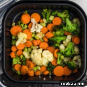 Crispy Air Fryer Veggies 10 Fully cooked frozen veggies in air fryer basket ready to serve.