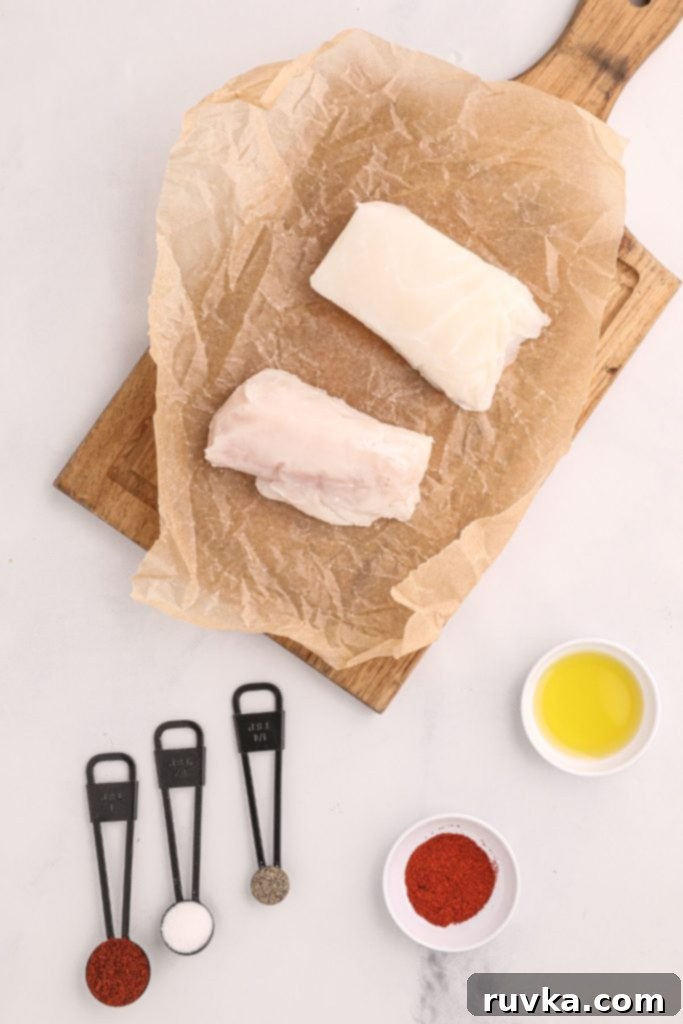 Perfect Air Fryer Halibut 3 Ingredients measured out for air fryer halibut, with spices in measuring spoons