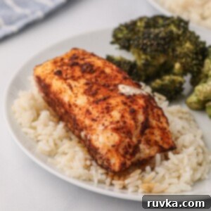 Perfect Air Fryer Halibut 9 Seasoned cooked halibut fillet on a bed of rice after being cooked in the air fryer