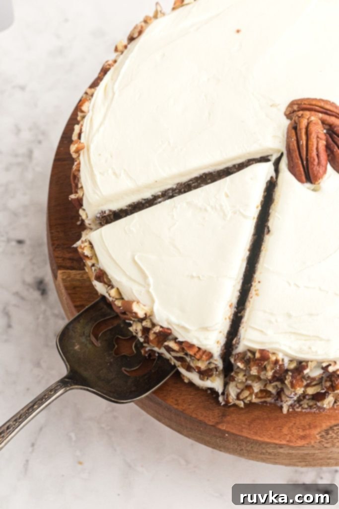 Air Fryer Carrot Cake Delight 10 Slice cut out of carrot cake being lifted with a spatula