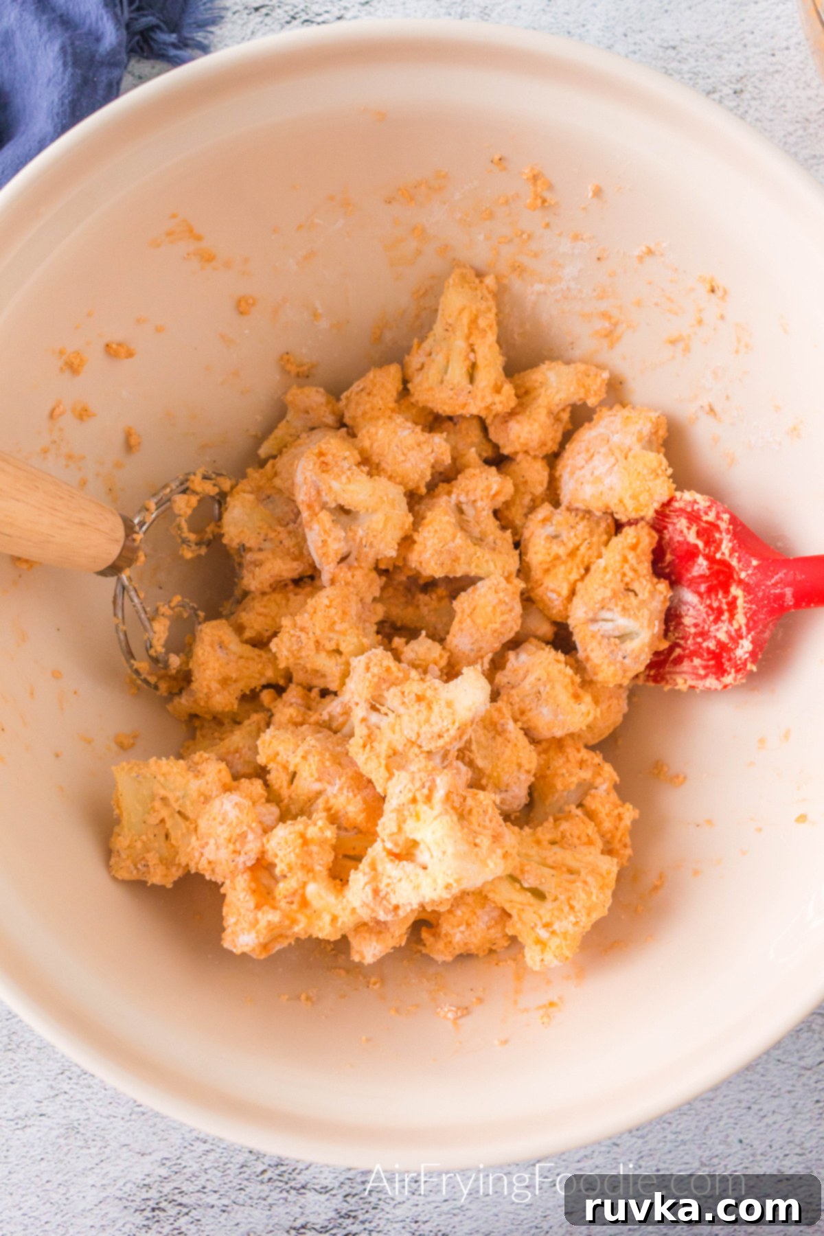 Spicy Air Fryer Cauliflower Wings 7 Cauliflower bites tossed in flour and seasoning mixture.