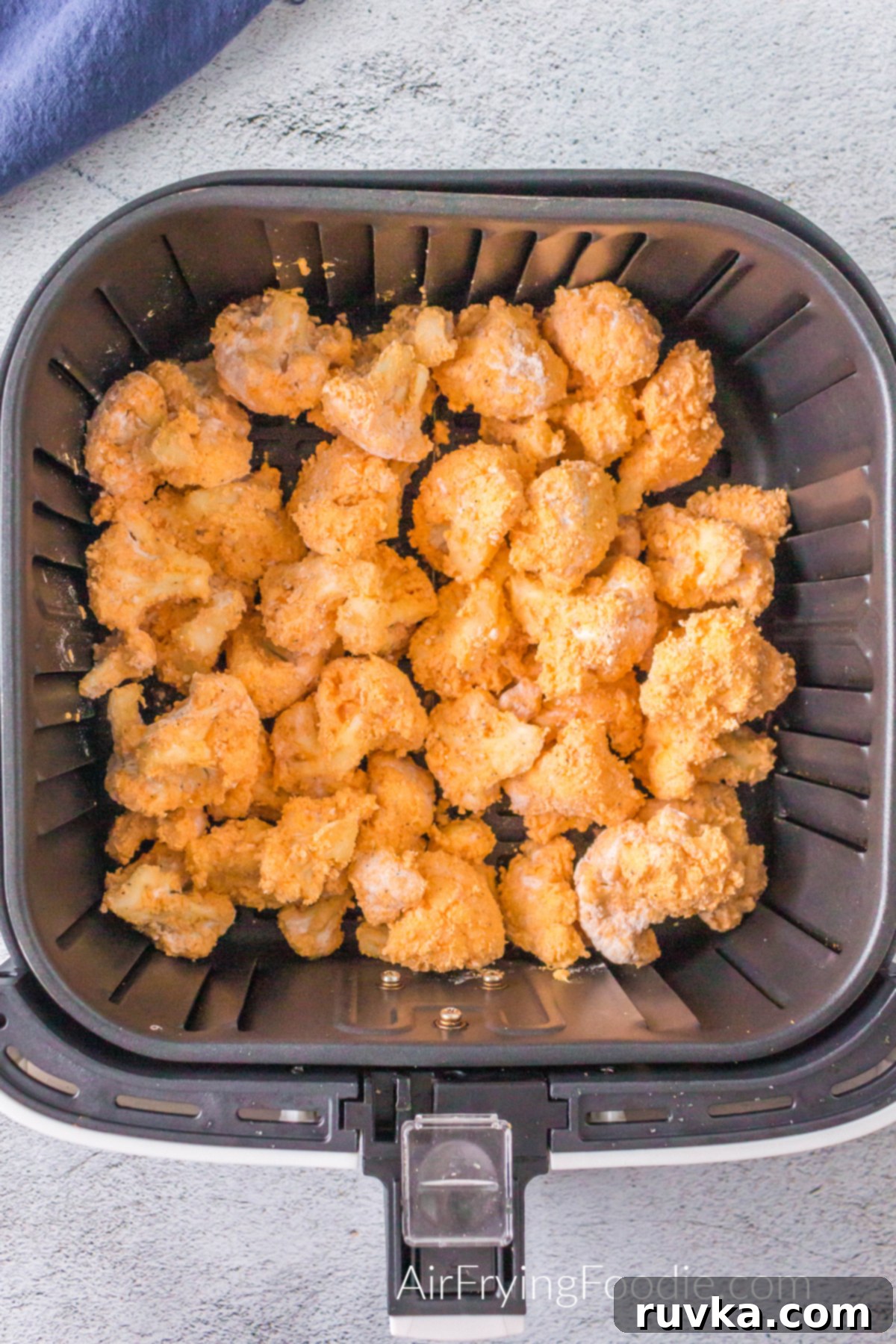 Spicy Air Fryer Cauliflower Wings 8 Buffalo Cauliflower in the air fryer ready to cook.