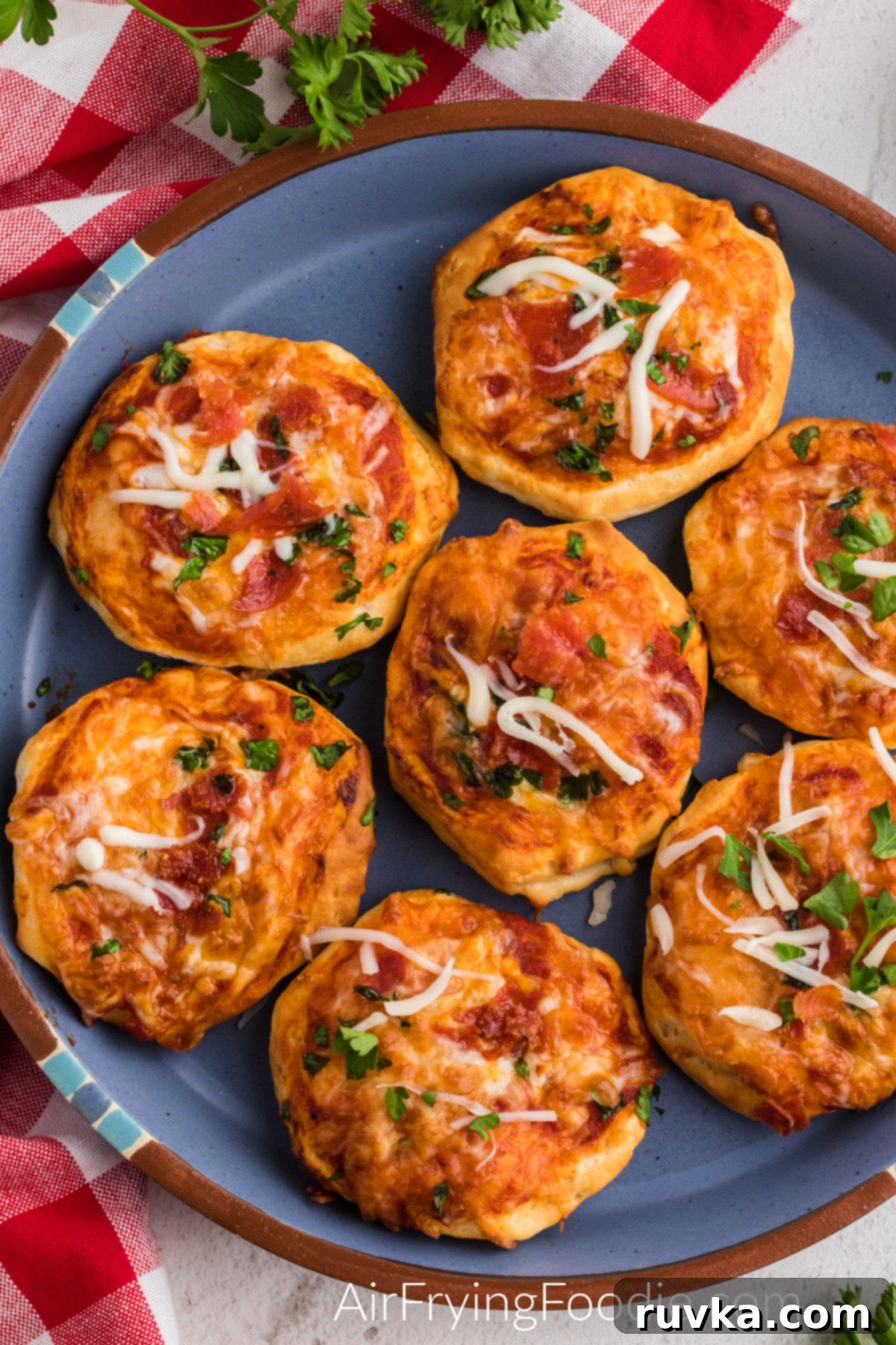 Crispy Air Fryer Pizza Bites 6 air fryer mini pizzas on a blue plate ready to serve
