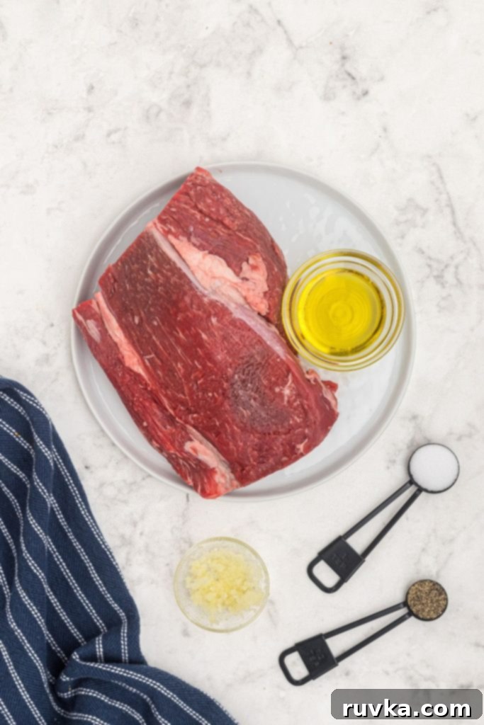 Perfect Air Fryer Beef Tenderloin 4 Ingredients measured out to season beef tenderloin, salt, pepper, garlic, olive oil