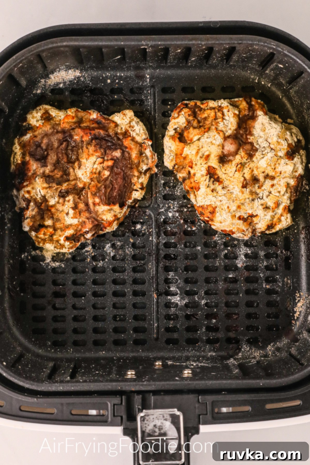 Crispy Air Fryer Chicken Fried Steak 7 Crispy air fryer chicken fried steaks in the basket, ready to serve.