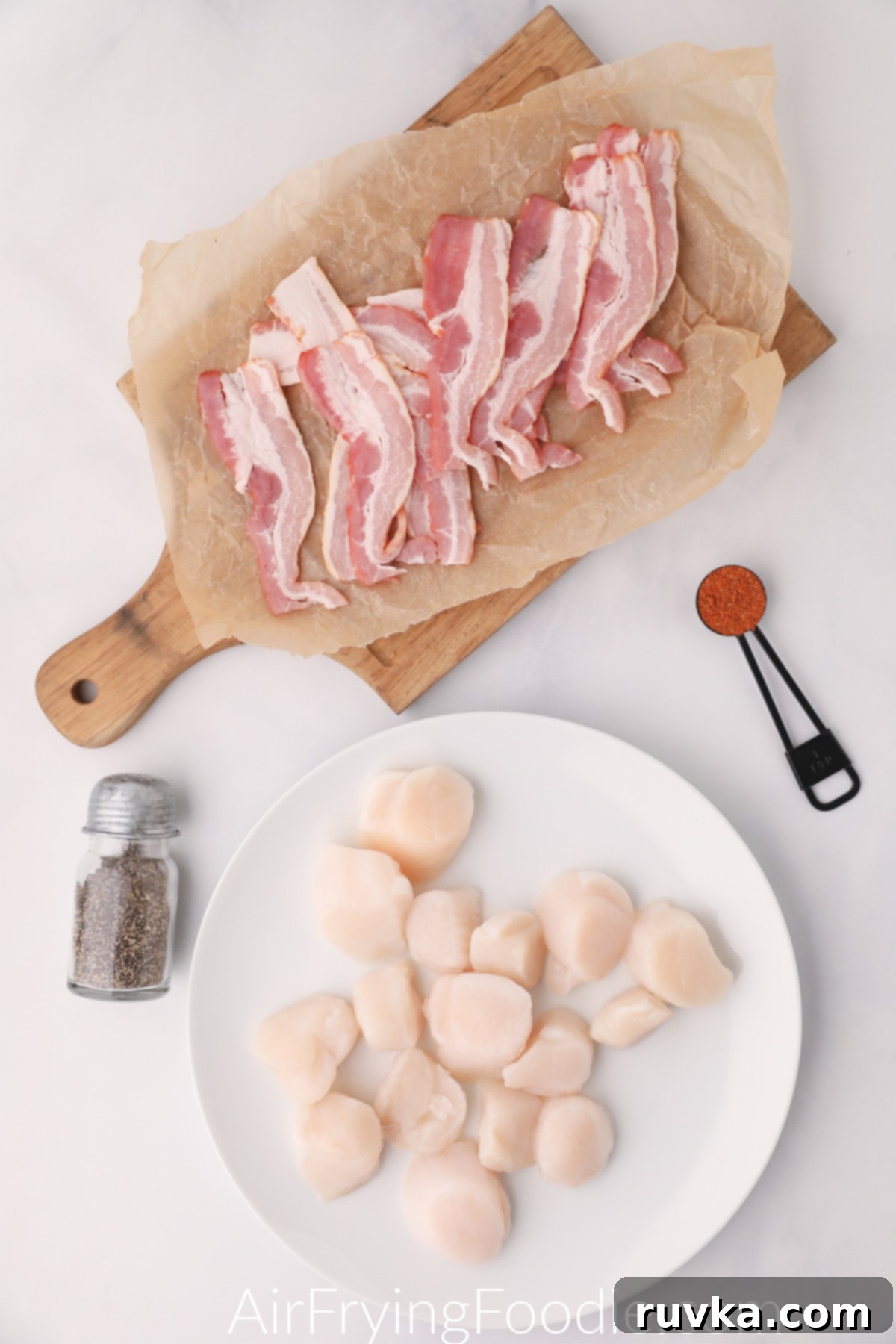 Crispy Air Fryer Bacon Wrapped Scallops 3 Ingredients needed to make bacon wrapped scallops in the air fryer - layed out on a table ready to be put together.