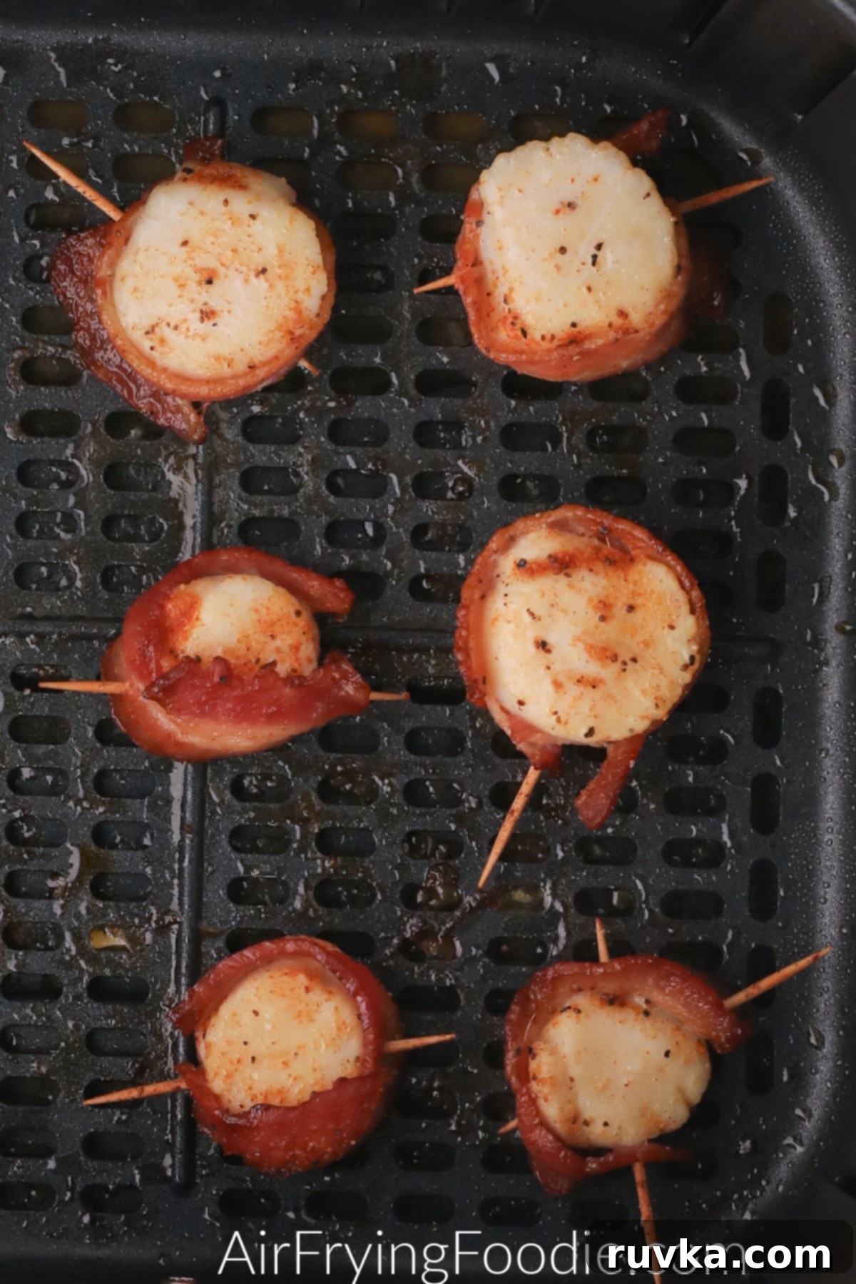 Crispy Air Fryer Bacon Wrapped Scallops 6 Scallops wrapped in bacon and cooked in the air fryer.