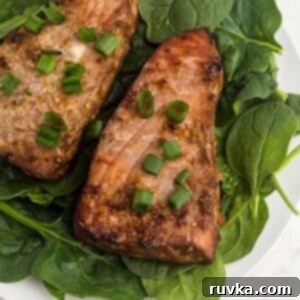 Crispy Air Fryer Tuna Steaks 8 Juicy close up of tuna steaks on spinach garnished with green onions