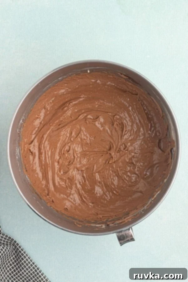 Decadent Air Fryer Chocolate Cheesecake 6 Chocolate cheesecake filling, mixed in a bowl.